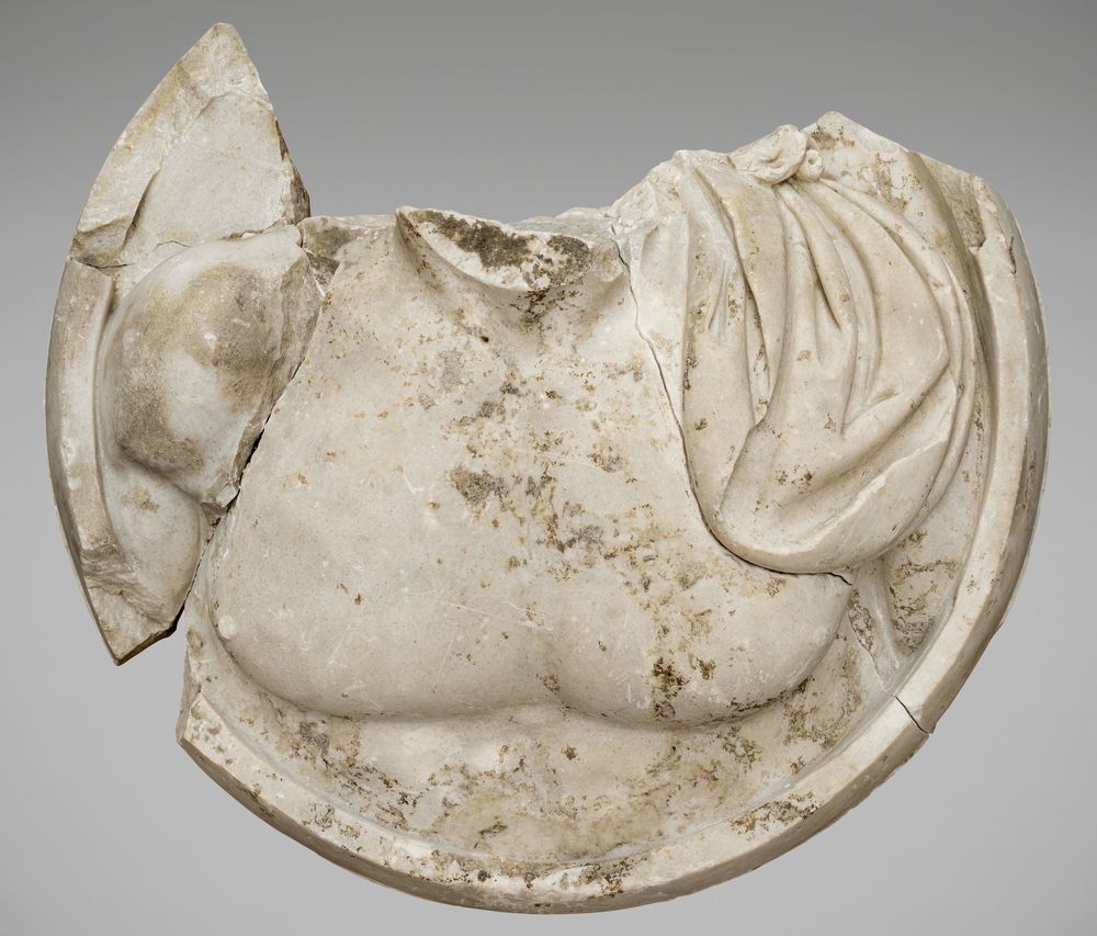 Médaillon au dieu acéphale et sa barbe